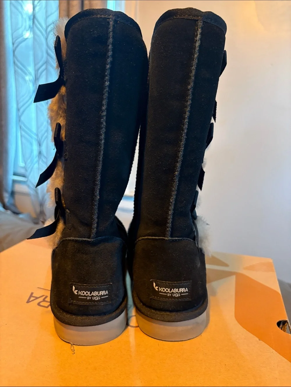 Koolaburra Black Faux-Suede Winter Boots with Gray Fur Pom-Poms and Ribbon